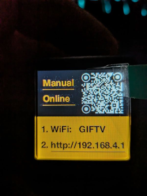Factory firmware display with the instructions: 1. WiFi GIFTV, 2. http://192.168.4.1, next to a QR code